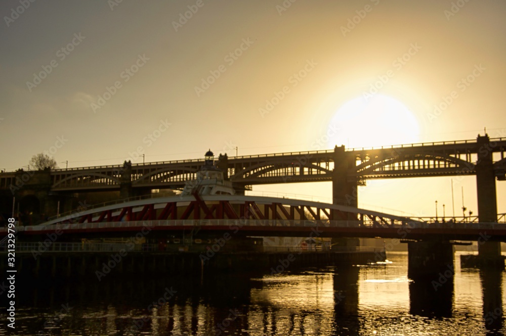 Wall mural bridge at sunset