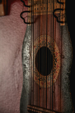 Close-up of a vintage, rusty ukelin, an obscure 12-string instrument