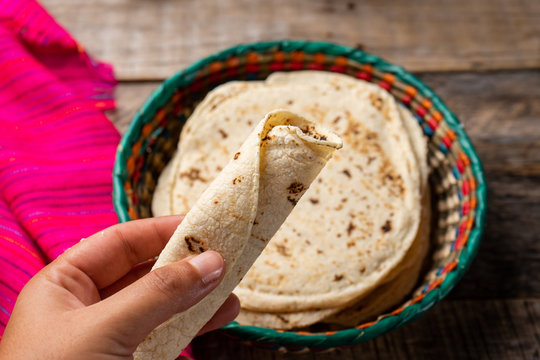 Mexican corn tortillas on wooden background