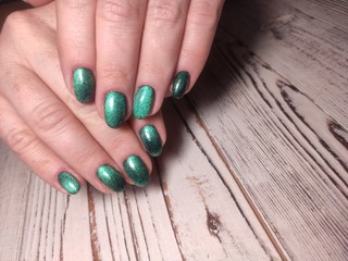 Beautiful woman's nails with beautiful christmas manicure