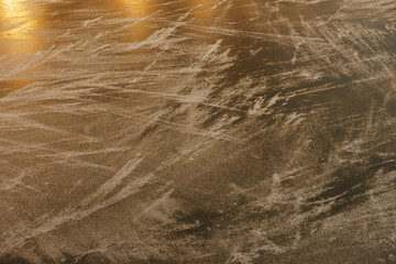 Ice rink surface. Photography of trails on the ice. Sports background.