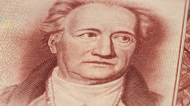 Johann Wolfgang von Goethe portrait on East German 20 mark (1964) banknote rotating. Low angle, macro. 4K, 422 10 bit