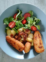 Summer salad with fried fish, healthy food