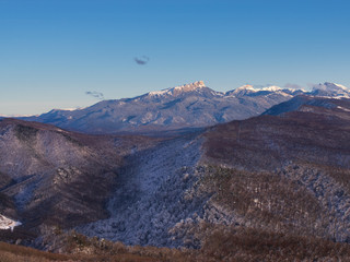 Winter sunset in caucasus mountains in Lagonaki, Adygea, Russia