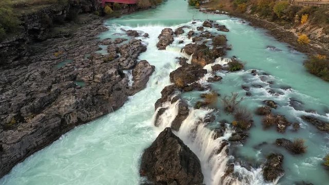 Waterfall Niagara on Cijevna (Cem) river near Podgorica and Tuzi in Montenegro, after heavy autumn rains in wet season. Drone fly over shot.