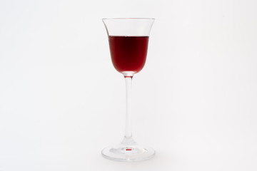 Elegant glass with liquor on a neutral gray background