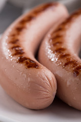 Close-up shot of fried sausages. Breakfast. Close up shot of grilled sausages