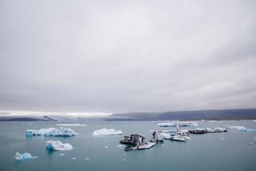 Icebergs in Jokulsarlon lagoon beneath Breidamerkurjokull glacier Sudhurland, Iceland. Place for text or advertising