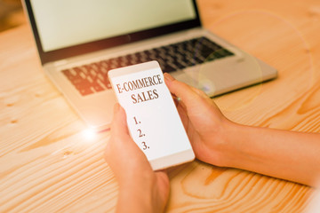Word writing text E Commerce Sales. Business photo showcasing activity of buying or selling of products on online service