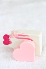 Valentine heart soaps on a white towel