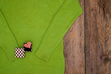 Valentine's day gift heart and box on a green pullover