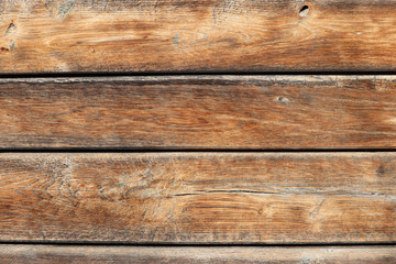 Wooden wall, old wood boards. Brown weathered panels texture with knots for background