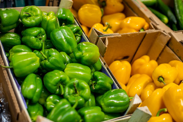 bell peppers in boxes on the counter