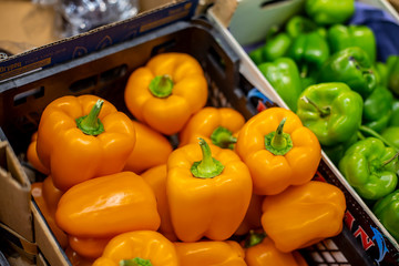 bell peppers in boxes on the counter