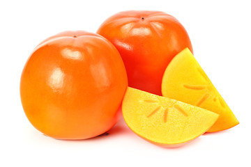 fresh ripe persimmons with slices isolated on white background