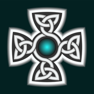 Celtic ornament in the shape of a cross. White cross on a dark background.