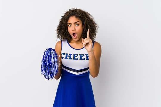 Young african american cheerleader woman isolated having an idea, inspiration concept.