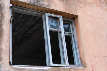 Old window with broken glass