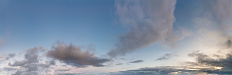 Fantastic clouds against blue sky, panorama