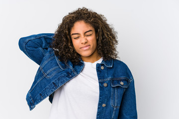 Young african american woman suffering neck pain due to sedentary lifestyle.