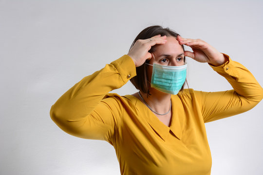 Sick Woman With Headache Standing Isolated On White Bacground. Sick Woman With Seasonal Infections, Flu, Allergy In Front Of White Background.