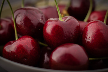 Dark Cherries Close Up in a White Bowl