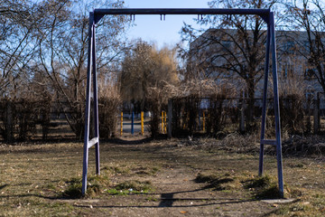 Fototapeta na wymiar Metal frame for a swing without a swing