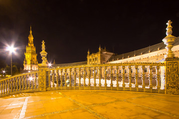 Obraz premium Night view of the bridges of Plaza de España, Seville, Spain