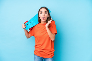 Young caucasian skater woman isolated surprised and shocked.