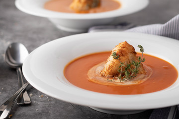 Tomato Soup with Large Crouton in White Bowl
