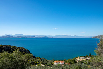 Naklejka na ściany i meble Relaxing colorful seascape with view on mountains of Peloponnese, Greece