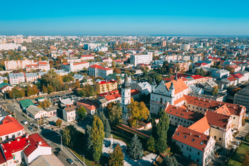 Fototapeta na wymiar Pinsk, Brest Region, Belarus. Pinsk Cityscape Skyline In Autumn Morning. Bird's-eye View Of Cathedral Of Name Of The Blessed Virgin Mary And Monastery Of The Greyfriars. Famous Historic Landmarks
