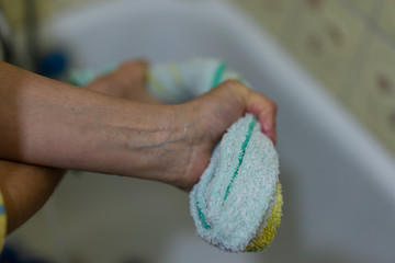 Hand wash, squeezing towels from water