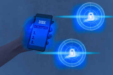 Writing note showing Disk Encryption. Business concept for the security mechanism used to protect...