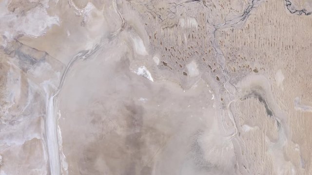 Aerial satellite time lapse of rivers from dry to flood forming lake Eyre Australia Simpson desert. Images furnished by Nasa