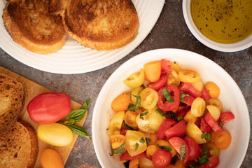 Bowl of Bruschetta with Tomatoes and Basil and Toast