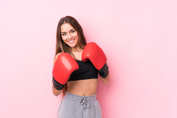 Young caucasian sporty woman boxing