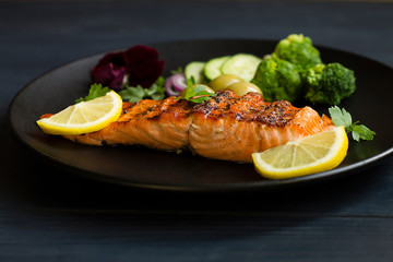 grilled fish steak with avocado and lemon