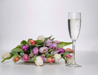  natural garden flowers tulips and glass of champagne 
