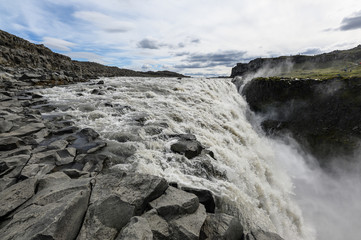 Closeup view of raging water stream of powerful Dettifoss waterfall in Iceland