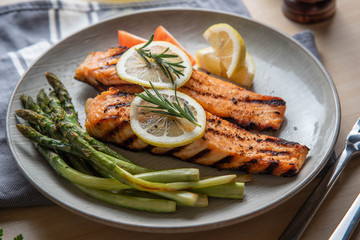 grilled salmon fillet on plate with asparagus