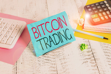 Handwriting text writing Bitcoin Trading. Conceptual photo buying and selling of cryptocurrency in...