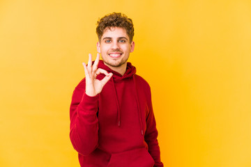  cheerful and confident showing ok gesture.