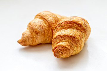 Traditional French mini croissants on a light background