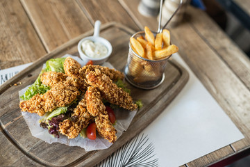 crispy kentucky fried chicken in a wooden table