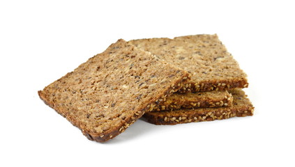 Slices of wholemeal dark bread isolated on a white background in close-up (high details)
