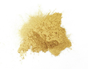 gold glitter powder on white background