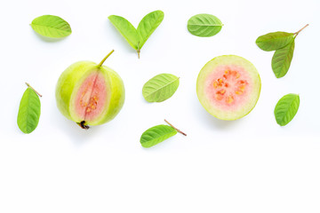 Pink guava with leaves on white background.