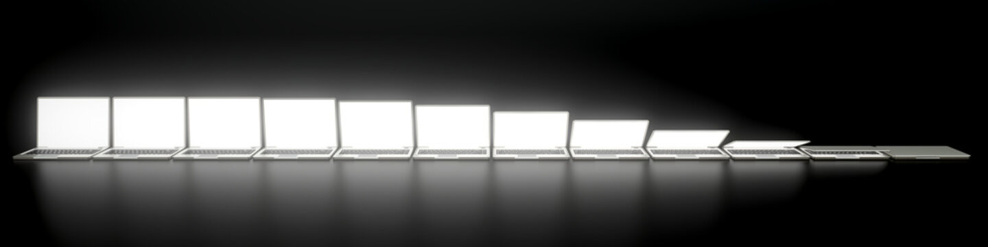 Some laptops on black surface with glowing screens - 3D rendering