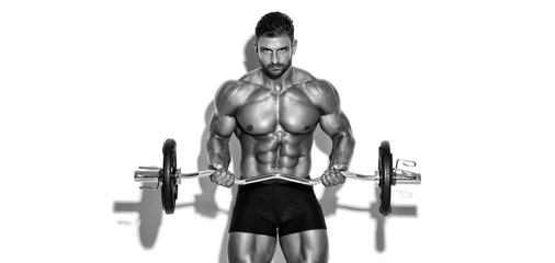 Fototapeta na wymiar Handsome Bodybuilder Lifting Weights. Performing Biceps Curls